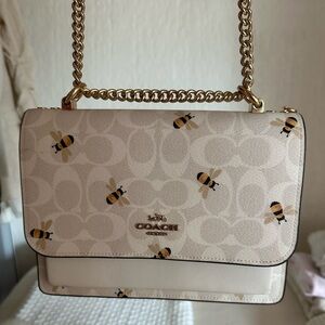 Spring coach purse
